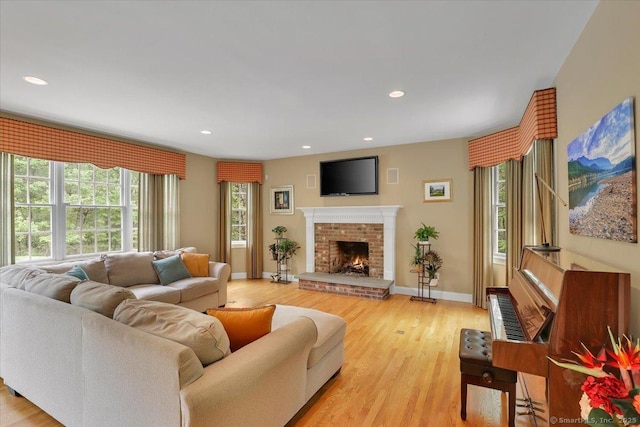 15 Surrey Ridge Rd, Killingworth, CT 06419 - living area featuring plenty of natural light, a brick fireplace, light wood finished floors, and recessed lighting