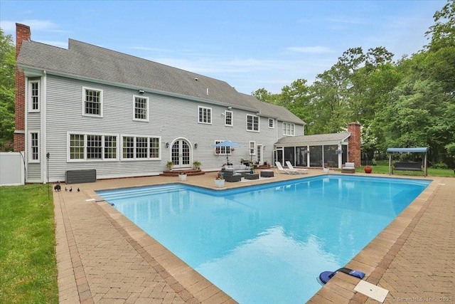 15 Surrey Ridge Rd, Killingworth, CT 06419 - swimming pool with a sunroom, a patio area, and an outdoor hangout area