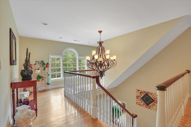 15 Surrey Ridge Rd, Killingworth, CT 06419 - hallway featuring an upstairs landing, a chandelier, light wood-style floors, and baseboards