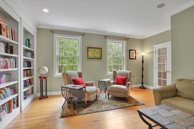 15 Surrey Ridge Rd, Killingworth, CT 06419 - living area with healthy amount of natural light, wood finished floors, baseboards, and ornamental molding