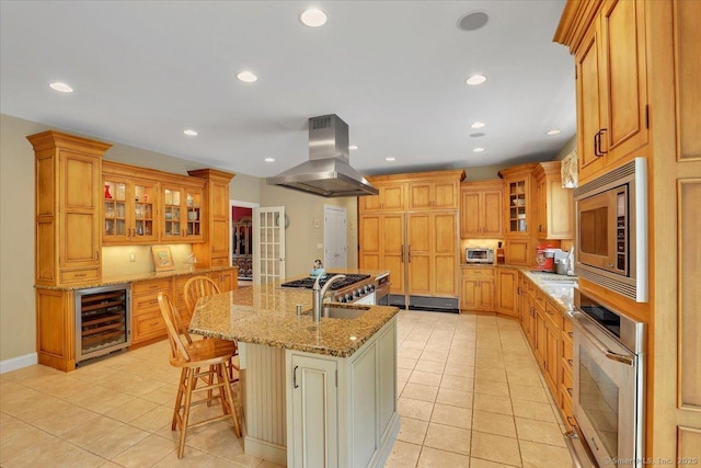 15 Surrey Ridge Rd, Killingworth, CT 06419 - kitchen with island exhaust hood, beverage cooler, stainless steel appliances, light tile patterned floors, and recessed lighting