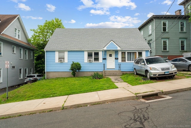 22 School St, New Britain, CT 06051 - view of front of house featuring a front lawn, cooling unit, and a shingled roof