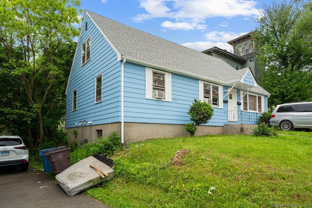 22 School St, New Britain, CT 06051 - bungalow featuring a front yard, roof with shingles, and a chimney