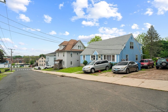 22 School St, New Britain, CT 06051 - view of front facade with a residential view and roof with shingles