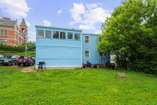 22 School St, New Britain, CT 06051 - rear view of house with a lawn