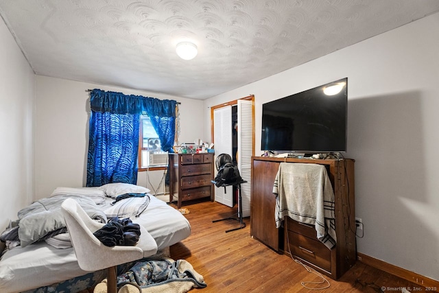 22 School St, New Britain, CT 06051 - bedroom with a textured ceiling, wood finished floors, and baseboards
