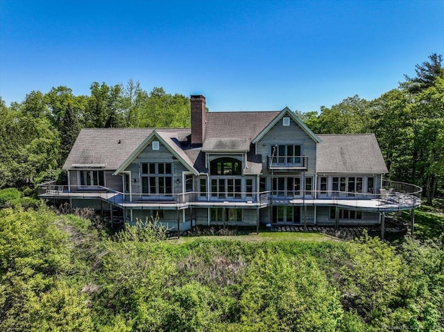 12 Fox Run, Sherman, CT 06784 - back of house featuring a chimney, a balcony, and a forest view