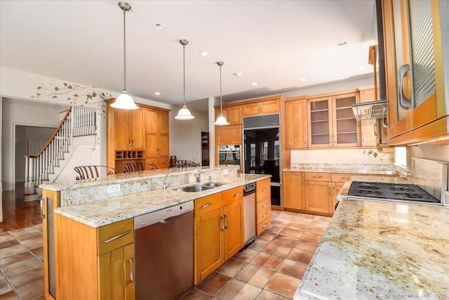12 Fox Run, Sherman, CT 06784 - kitchen featuring appliances with stainless steel finishes, a sink, a kitchen island with sink, light stone countertops, and glass insert cabinets