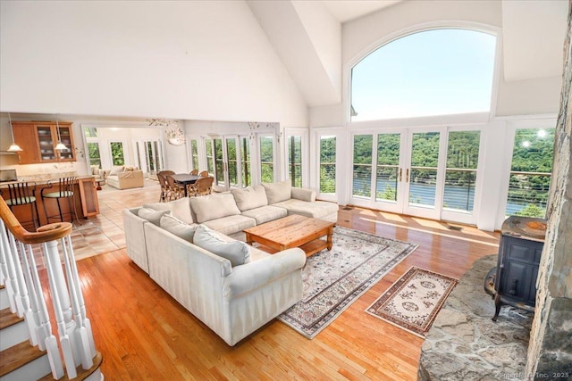12 Fox Run, Sherman, CT 06784 - living room featuring high vaulted ceiling, a wood stove, and light wood-type flooring