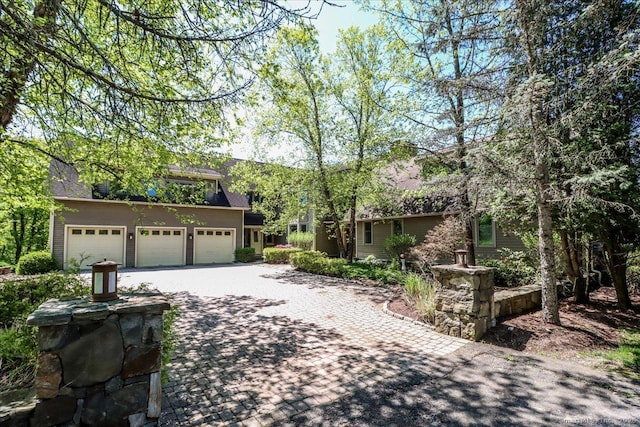 12 Fox Run, Sherman, CT 06784 - obstructed view of property with decorative driveway and an attached garage