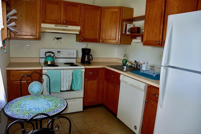 333 W Ave Unit 4, Milford, CT 06461 - kitchen featuring white appliances, under cabinet range hood, a sink, and light countertops