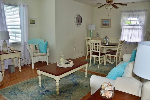 333 W Ave Unit 4, Milford, CT 06461 - living area with ceiling fan, plenty of natural light, and wood finished floors
