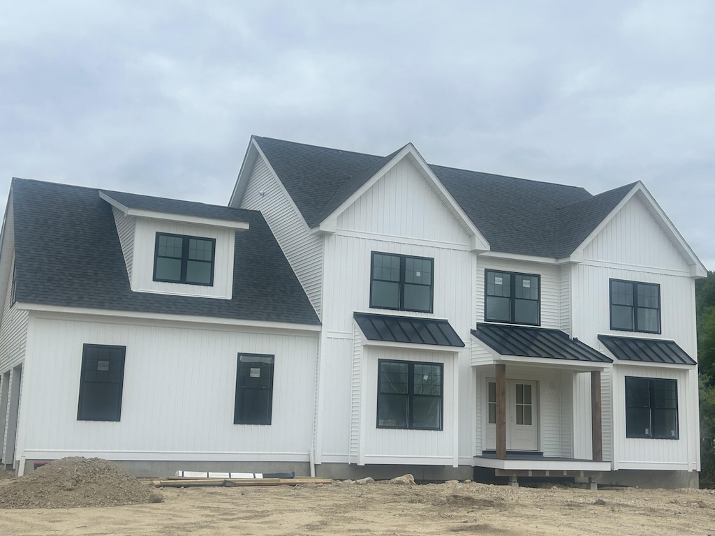 15 Rocco Dr, East Lyme, CT 06333 - modern inspired farmhouse featuring a standing seam roof, metal roof, roof with shingles, and a porch