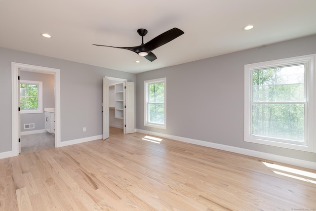 81 Nelson Dr, Burlington, CT 06013 - unfurnished bedroom with multiple windows, light wood-style floors, baseboards, and recessed lighting