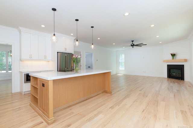 81 Nelson Dr, Burlington, CT 06013 - kitchen with high end refrigerator, healthy amount of natural light, recessed lighting, a large island, and light countertops