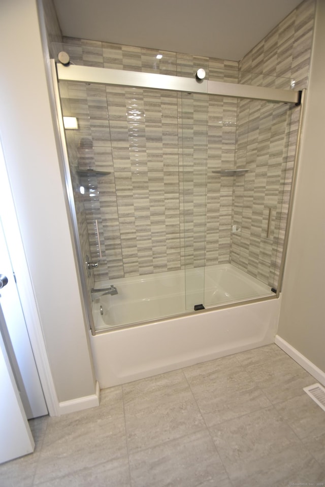 252 Plains Rd, Tolland, CT 06084 - bathroom with bath / shower combo with glass door, baseboards, and tile patterned flooring