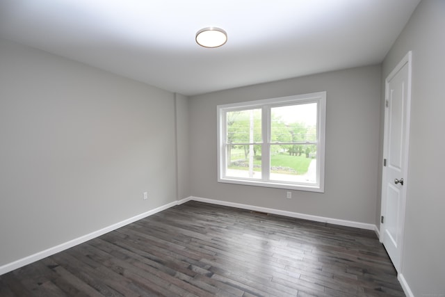 252 Plains Rd, Tolland, CT 06084 - spare room featuring dark wood-style flooring and baseboards