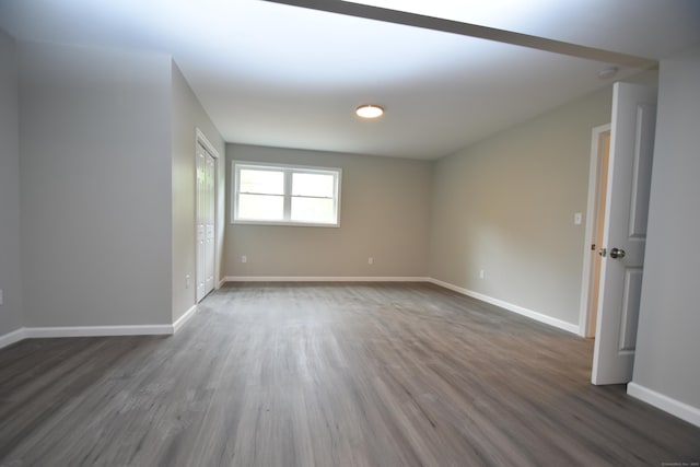 252 Plains Rd, Tolland, CT 06084 - unfurnished room with dark wood-style floors and baseboards