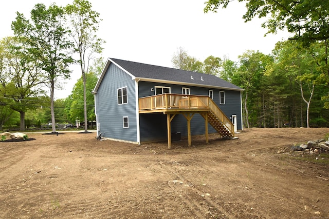252 Plains Rd, Tolland, CT 06084 - back of house featuring stairs, a wooden deck, and dirt driveway