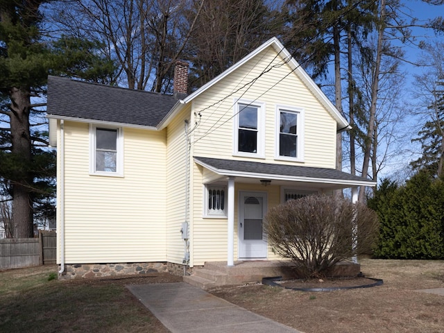 33 Prince St, Bristol, CT 06010 - view of front of home with a chimney, a shingled roof, and a porch