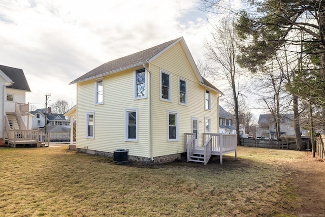 33 Prince St, Bristol, CT 06010 - rear view of house with a wooden deck, central AC unit, and a residential view