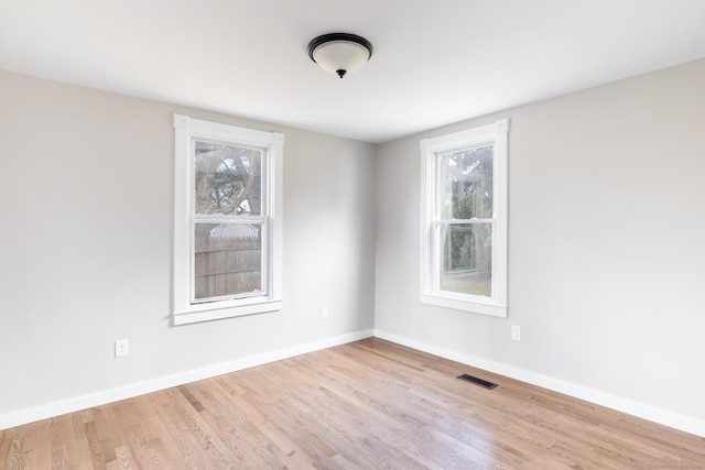33 Prince St, Bristol, CT 06010 - spare room featuring wood finished floors and baseboards