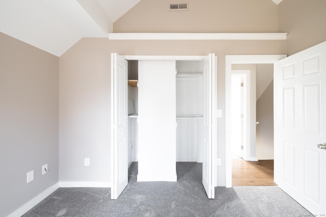 33 Prince St, Bristol, CT 06010 - unfurnished bedroom featuring vaulted ceiling, carpet, a closet, and baseboards