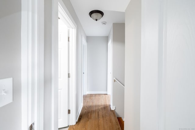33 Prince St, Bristol, CT 06010 - hall featuring an upstairs landing, wood finished floors, and baseboards