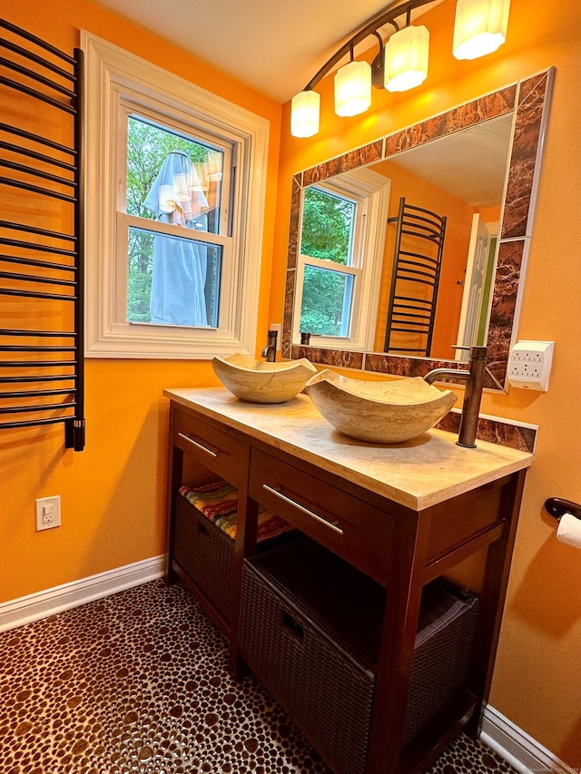 1 Russell Ln, Simsbury, CT 06070 - bathroom featuring radiator, baseboards, and vanity