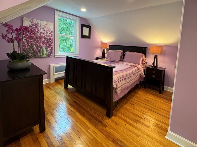 1 Russell Ln, Simsbury, CT 06070 - bedroom with light wood-type flooring, lofted ceiling, and baseboards