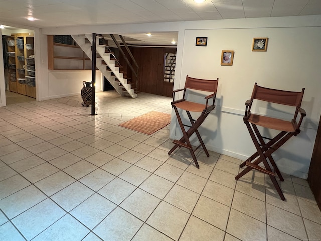 1 Russell Ln, Simsbury, CT 06070 - finished basement featuring stairs, wooden walls, and light tile patterned floors