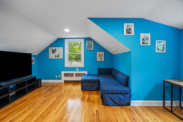 1 Russell Ln, Simsbury, CT 06070 - living area with hardwood / wood-style flooring, vaulted ceiling, and baseboards