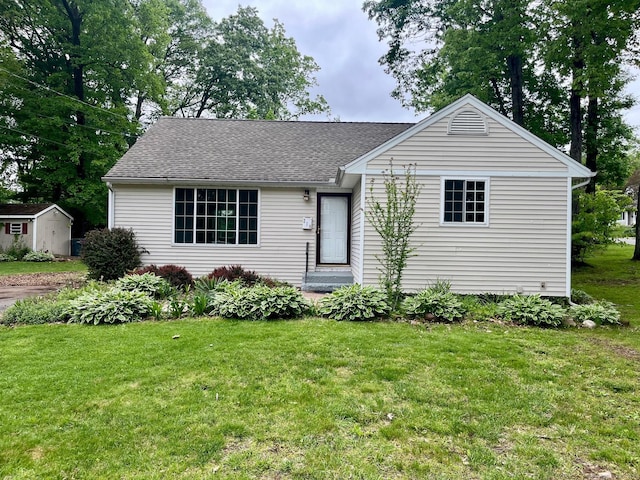 219 French St, Bristol, CT 06010 - single story home featuring a front yard, roof with shingles, and an outdoor structure