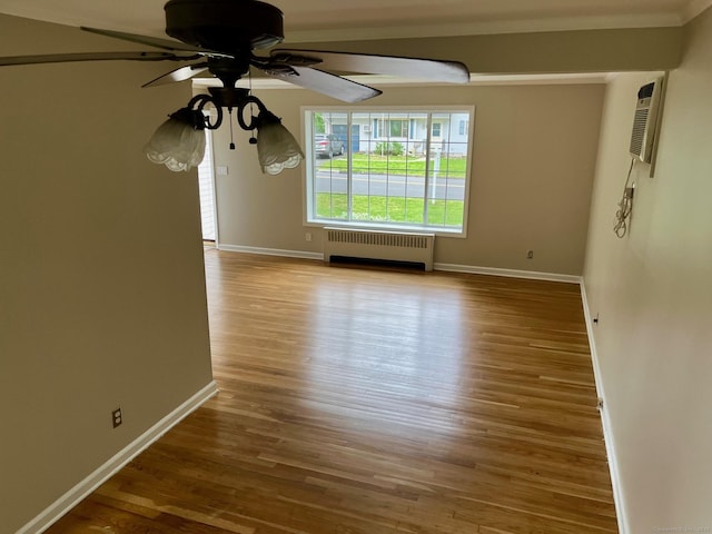219 French St, Bristol, CT 06010 - spare room featuring radiator, a ceiling fan, baseboards, and wood finished floors