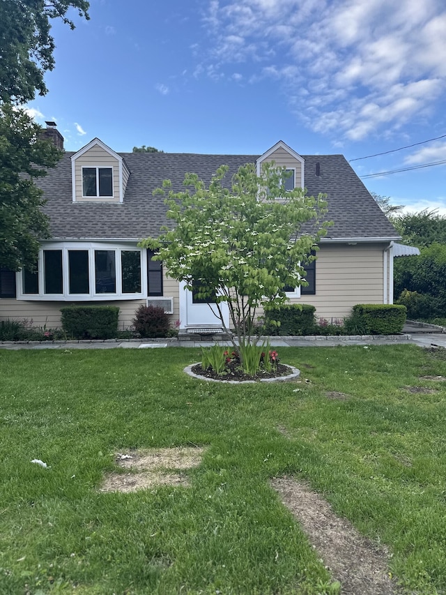 16 Neponsit St, Stamford, CT 06902 - cape cod-style house with a shingled roof and a front lawn