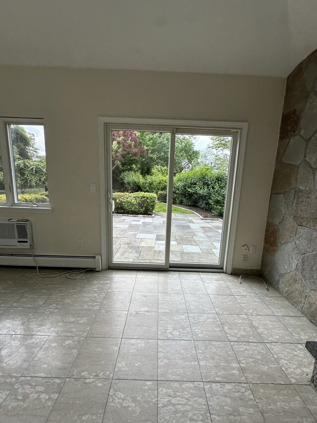 16 Neponsit St, Stamford, CT 06902 - empty room featuring a baseboard heating unit, healthy amount of natural light, and an AC wall unit