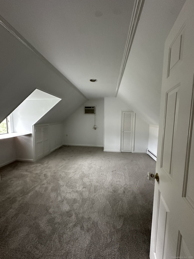 16 Neponsit St, Stamford, CT 06902 - bonus room with a baseboard radiator, lofted ceiling, carpet floors, and a wall mounted air conditioner