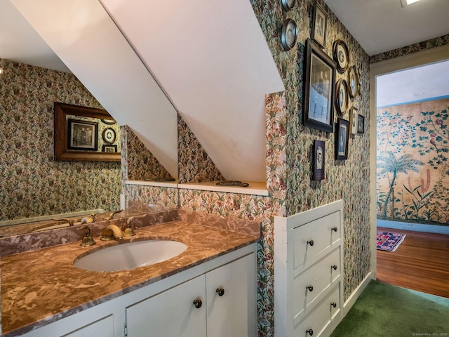 30 Meeting House Ln, Madison, CT 06443 - bathroom featuring wallpapered walls, vanity, and wood finished floors