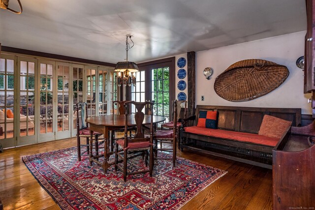 30 Meeting House Ln, Madison, CT 06443 - dining room featuring a chandelier and wood finished floors