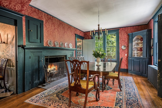 30 Meeting House Ln, Madison, CT 06443 - dining area with wallpapered walls, hardwood / wood-style floors, and a fireplace with flush hearth