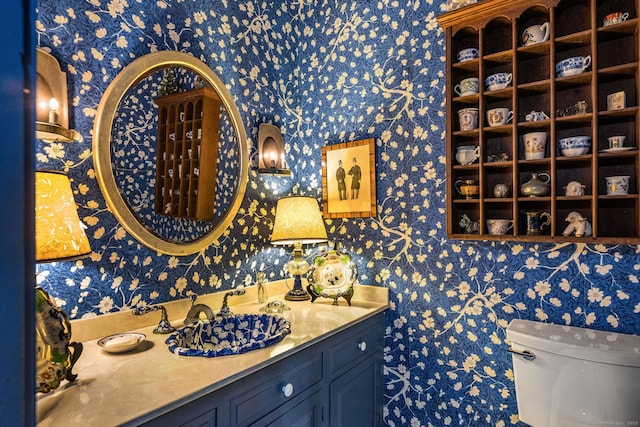 30 Meeting House Ln, Madison, CT 06443 - bathroom with wallpapered walls, toilet, and vanity
