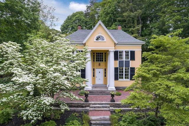 30 Meeting House Ln, Madison, CT 06443 - greek revival house with a chimney and roof with shingles