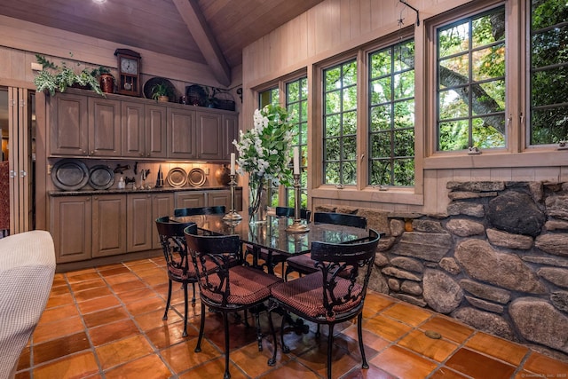 30 Meeting House Ln, Madison, CT 06443 - dining room with wood ceiling with exposed beams, light tile patterned floors, plenty of natural light, wood walls, and high vaulted ceiling