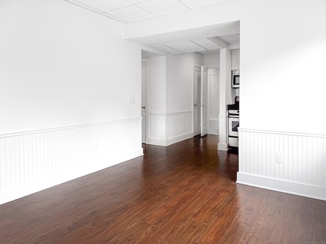 70 Strawberry Hill Ave Unit 5Gr4, Stamford, CT 06902 - unfurnished room with wainscoting and dark wood-type flooring