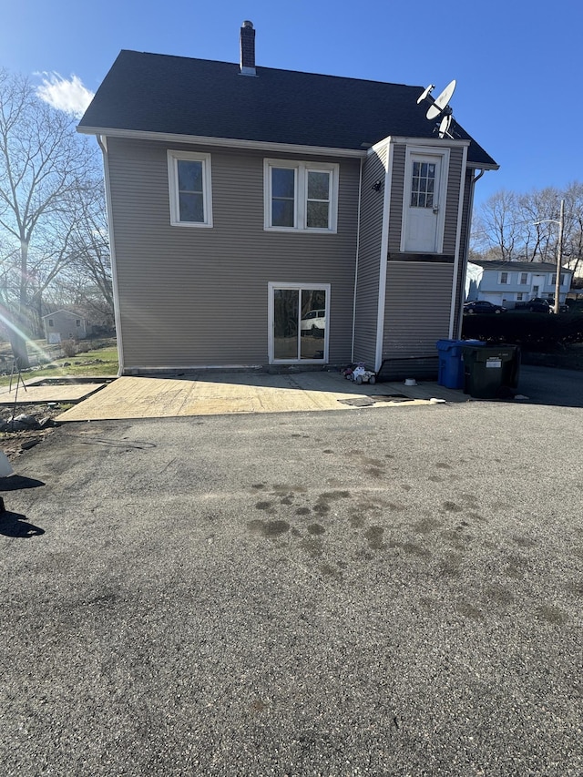 7 Carver Ave, Norwich, CT 06360 - back of house with a chimney