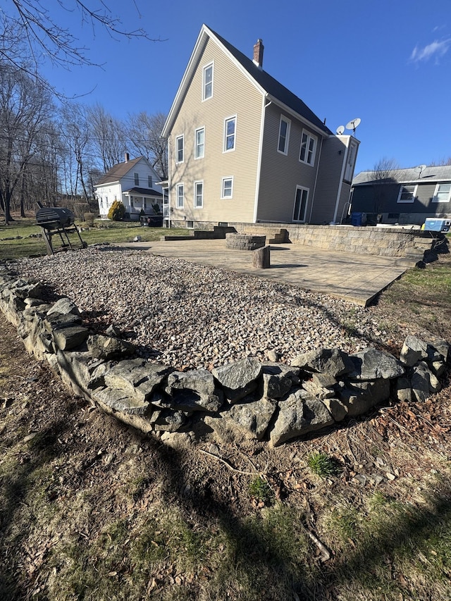 7 Carver Ave, Norwich, CT 06360 - view of property exterior with a chimney