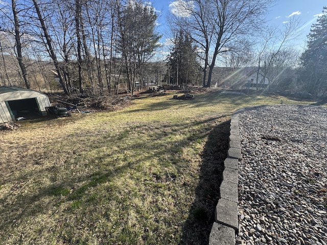 7 Carver Ave, Norwich, CT 06360 - view of grassy yard with an outbuilding