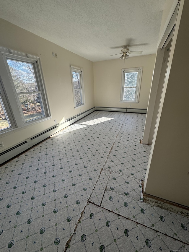 7 Carver Ave, Norwich, CT 06360 - empty room with a textured ceiling, a ceiling fan, a baseboard heating unit, and baseboards