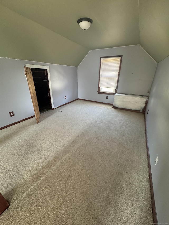 7 Carver Ave, Norwich, CT 06360 - additional living space with carpet floors, vaulted ceiling, and baseboards