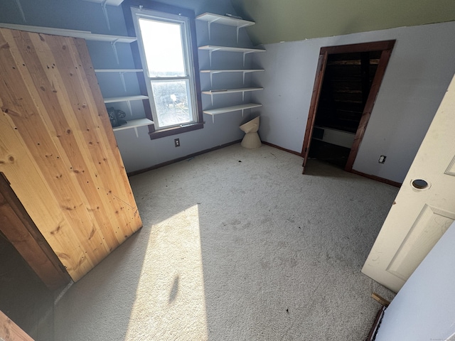 7 Carver Ave, Norwich, CT 06360 - unfurnished bedroom featuring carpet floors, lofted ceiling, and baseboards